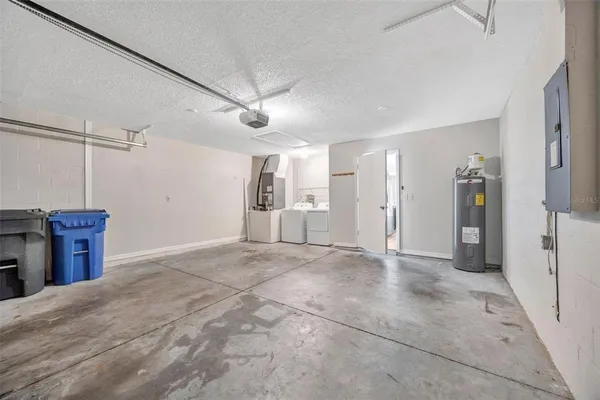 a view of a kitchen with a sink and a refrigerator