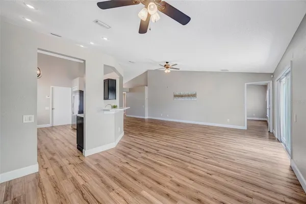 a view of a living room with wooden floor