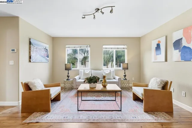 a living room with furniture or window and a wooden floor