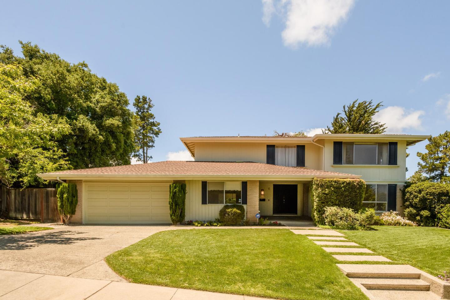 a front view of a house with a yard