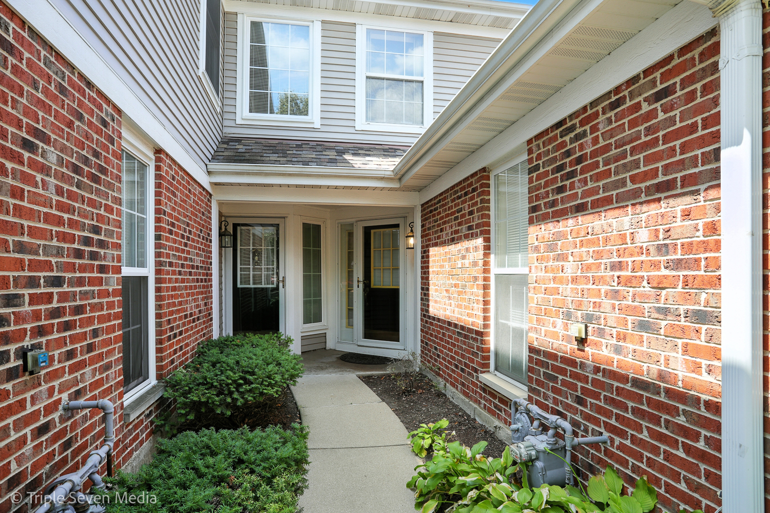 1956 North Silver Lake Road Arlington Heights, IL 60004 - Photo 2 of 33 a view of a house with a large window and wooden floor