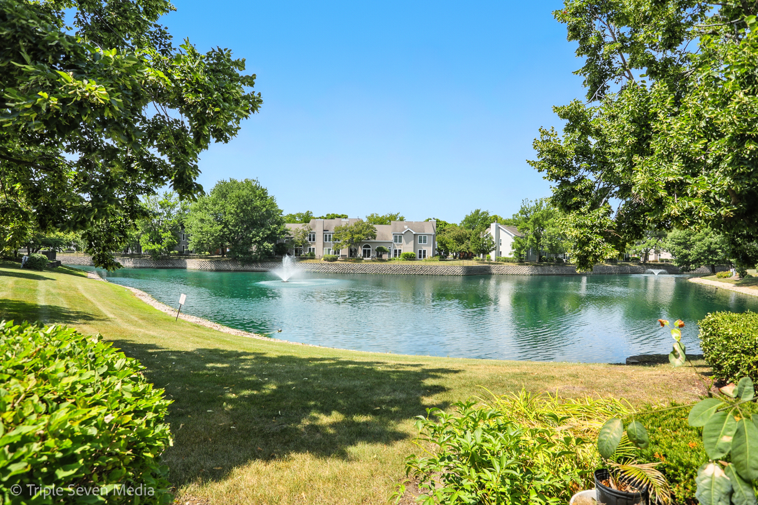 1956 North Silver Lake Road Arlington Heights, IL 60004 - Photo 3 of 33 a view of a lake with a building in the background