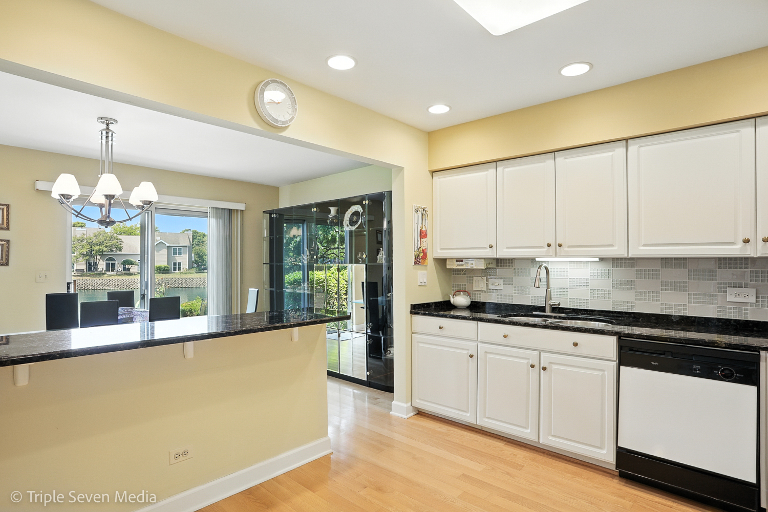 1956 North Silver Lake Road Arlington Heights, IL 60004 - Photo 10 of 33 a large kitchen with granite countertop a sink and white cabinets