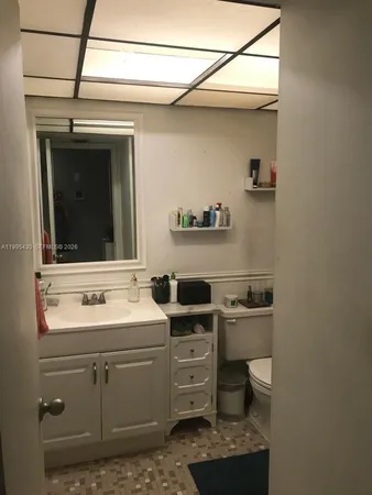 a bathroom with a toilet and a sink