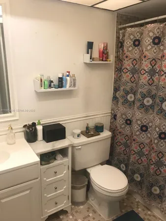 a kitchen with a stove and a refrigerator