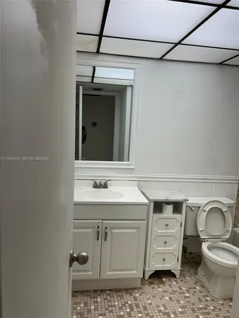 a stove top oven sitting inside of a kitchen