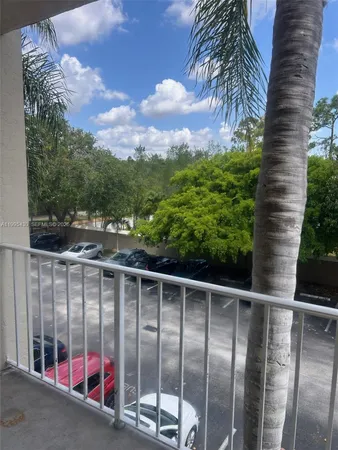 a view of backyard with swimming pool and outdoor seating