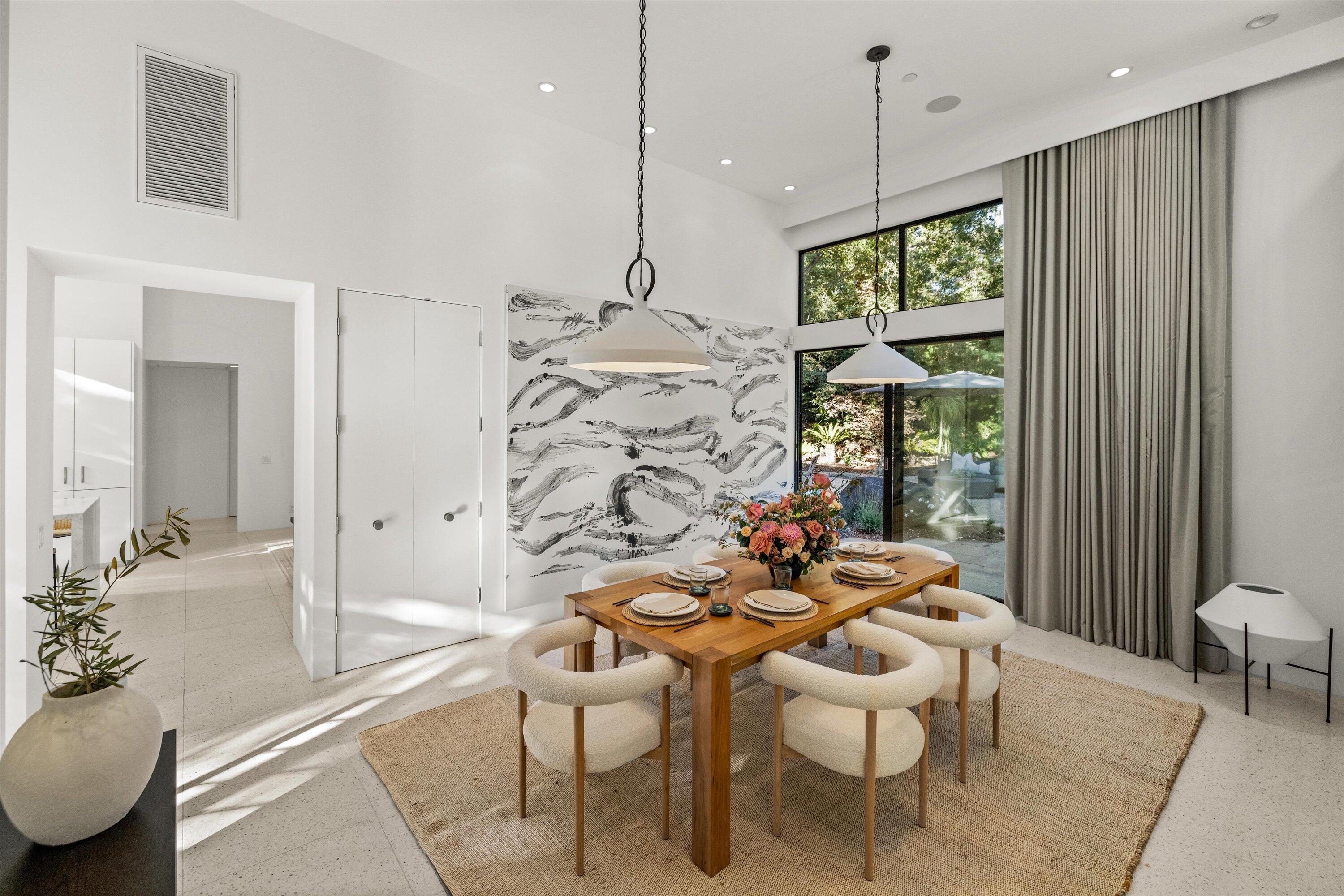 840 Riven Rock Road Montecito, CA 93108 - Photo 12 of 52 a dining room with furniture and wooden floor