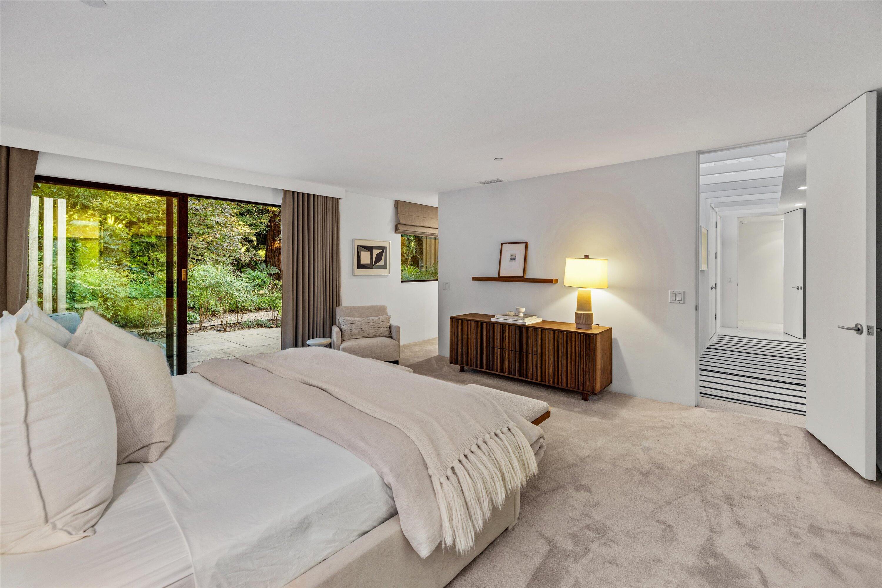 840 Riven Rock Road Montecito, CA 93108 - Photo 18 of 52 a bedroom with a bed and large windows