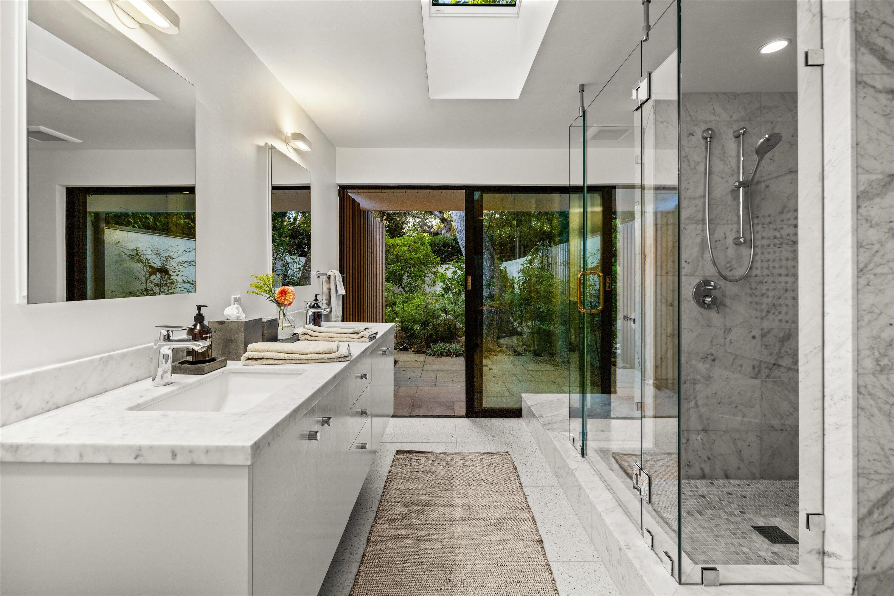 840 Riven Rock Road Montecito, CA 93108 - Photo 20 of 52 a bathroom with a granite countertop sink a toilet and shower