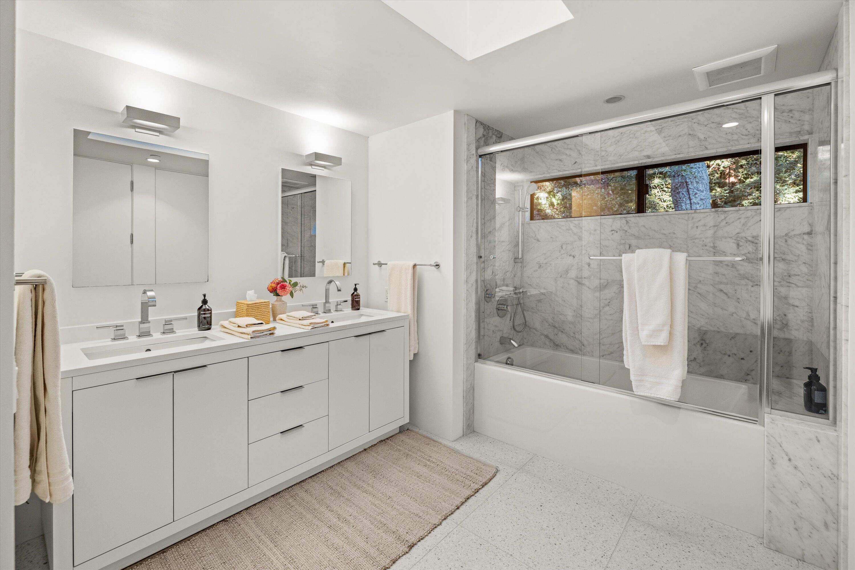 840 Riven Rock Road Montecito, CA 93108 - Photo 30 of 52 a bathroom with a double vanity sink mirror and shower