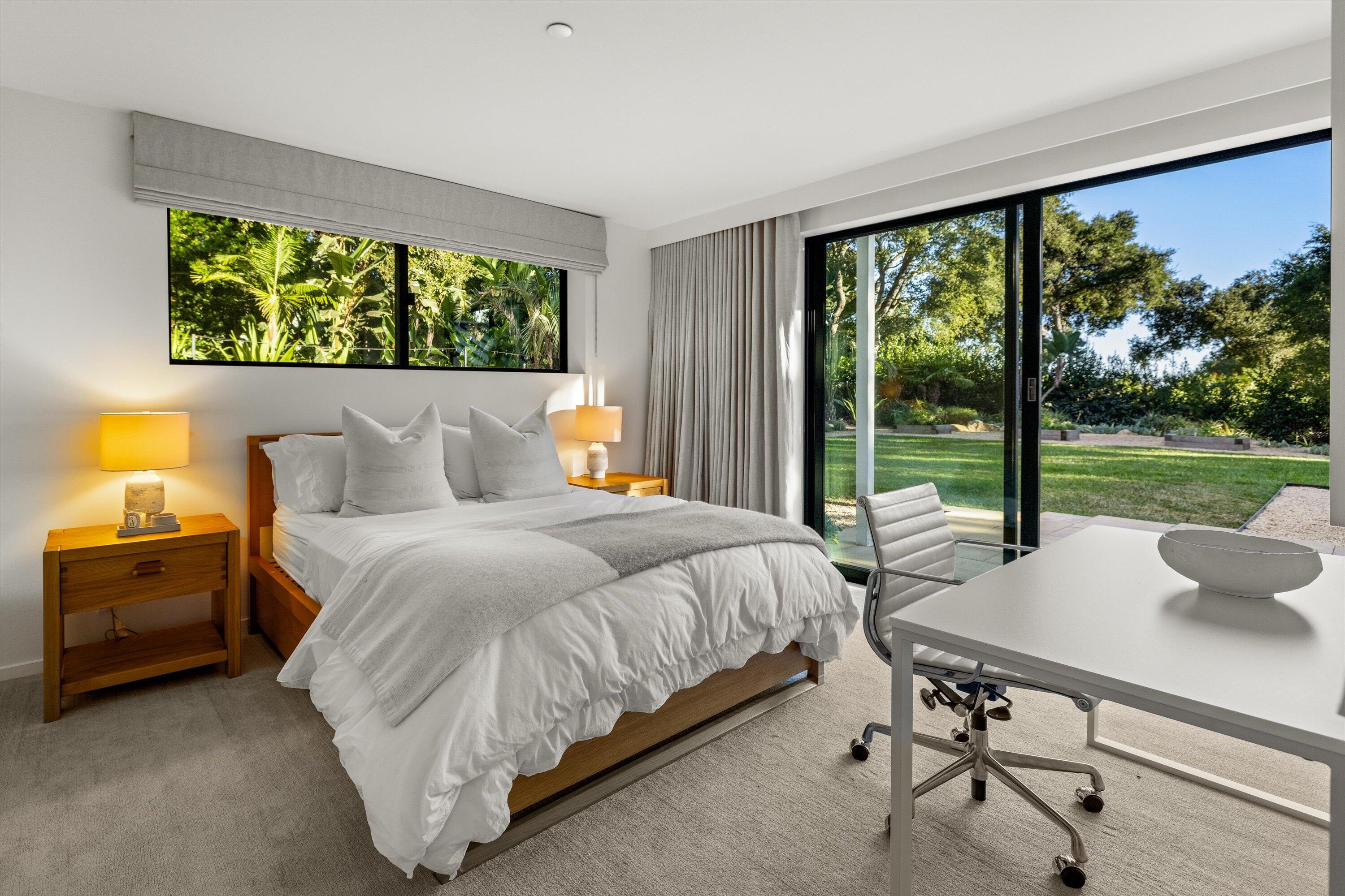 840 Riven Rock Road Montecito, CA 93108 - Photo 31 of 52 a spacious bedroom with a bed and a large window
