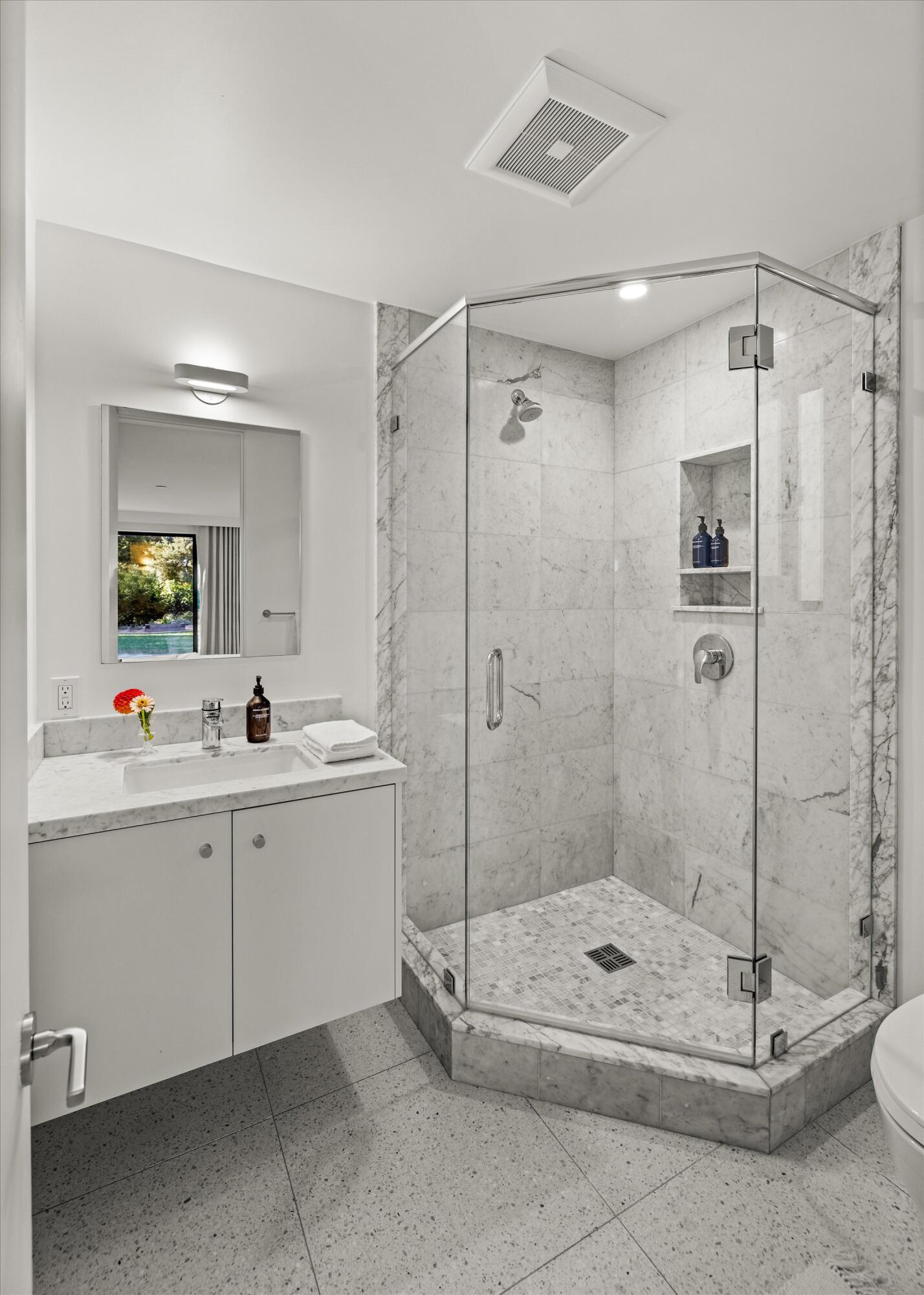 840 Riven Rock Road Montecito, CA 93108 - Photo 32 of 52 a bathroom with a shower a sink and mirror