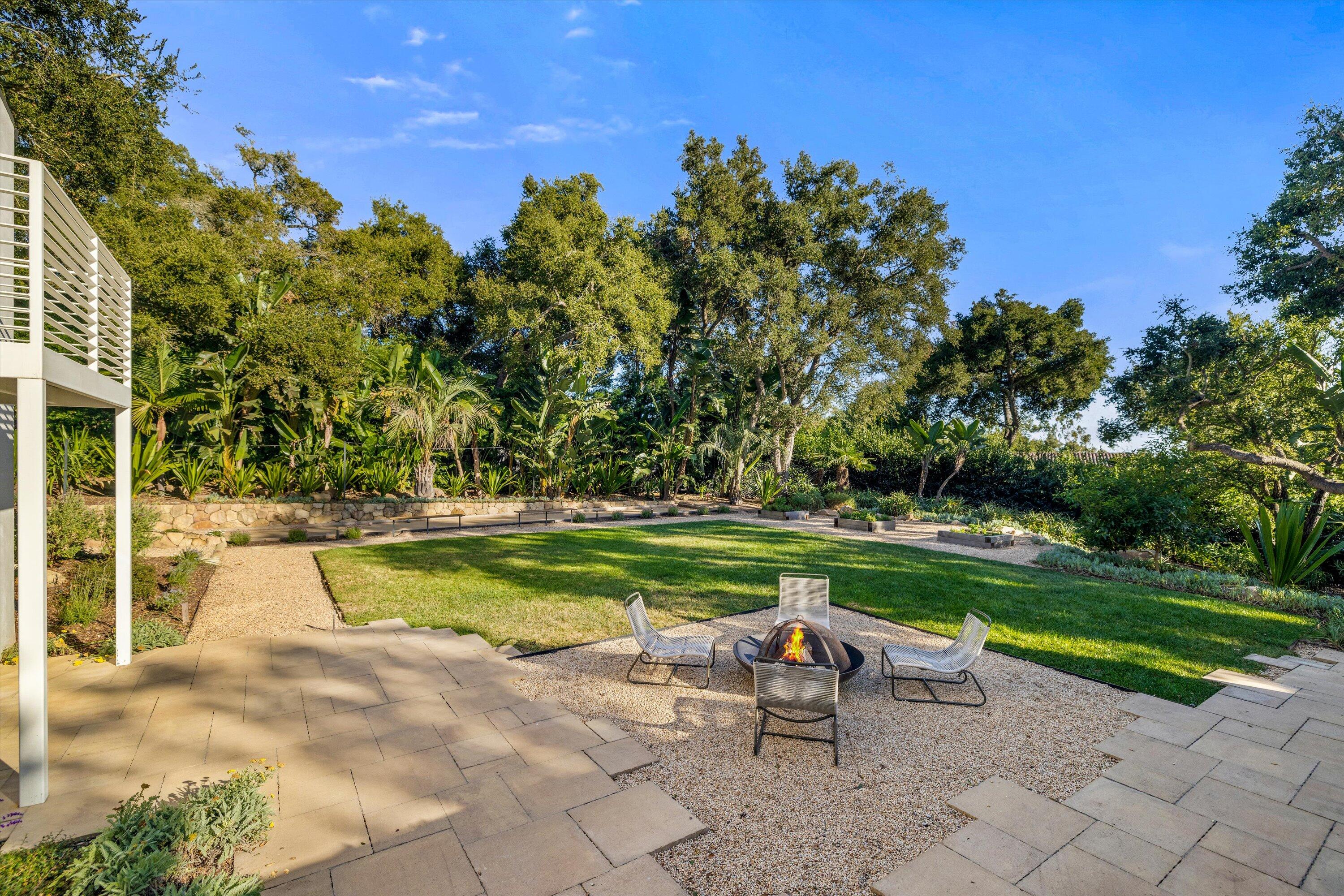 840 Riven Rock Road Montecito, CA 93108 - Photo 34 of 52 a view of a swimming pool with a yard