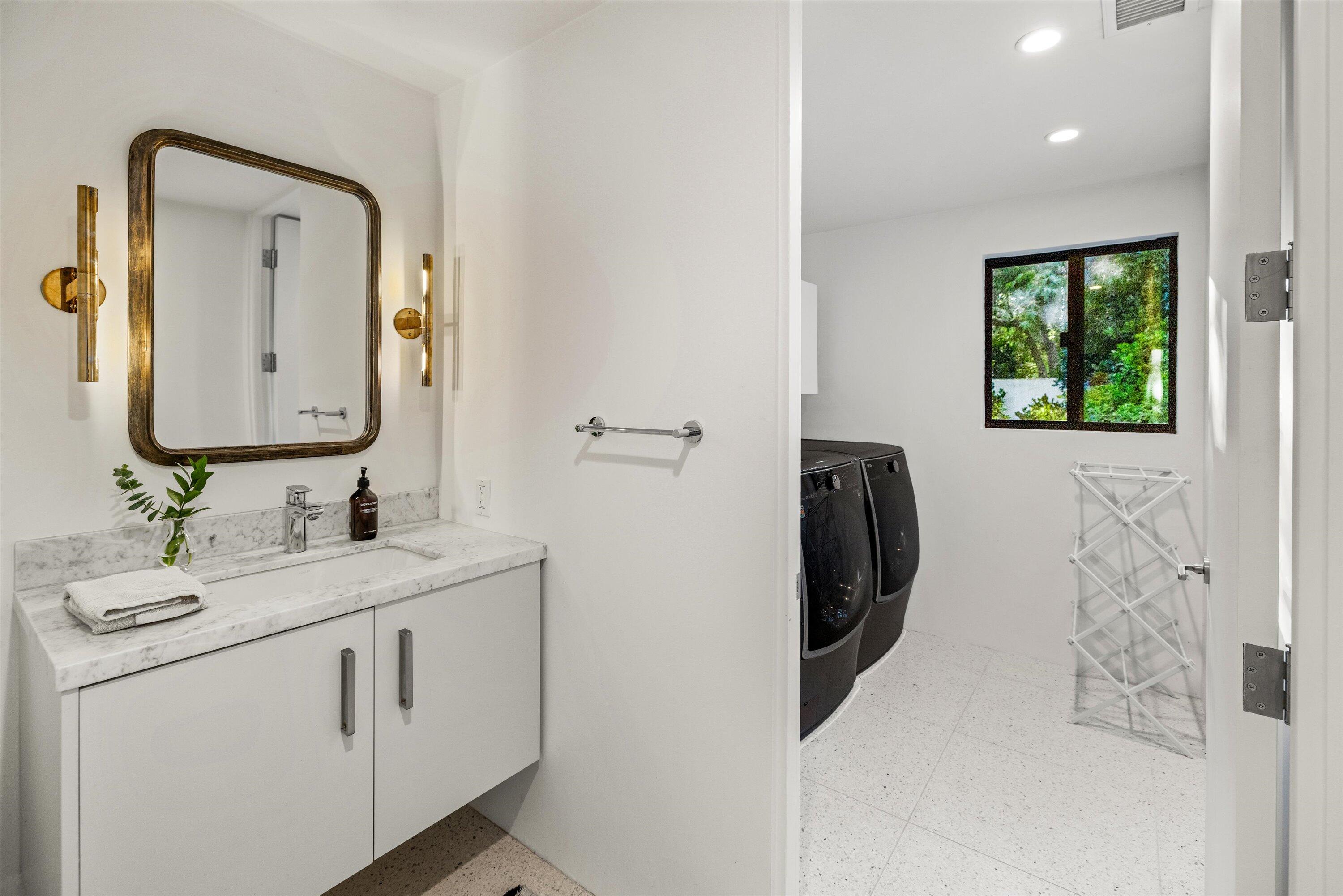 840 Riven Rock Road Montecito, CA 93108 - Photo 40 of 52 a bathroom with a sink vanity and a mirror