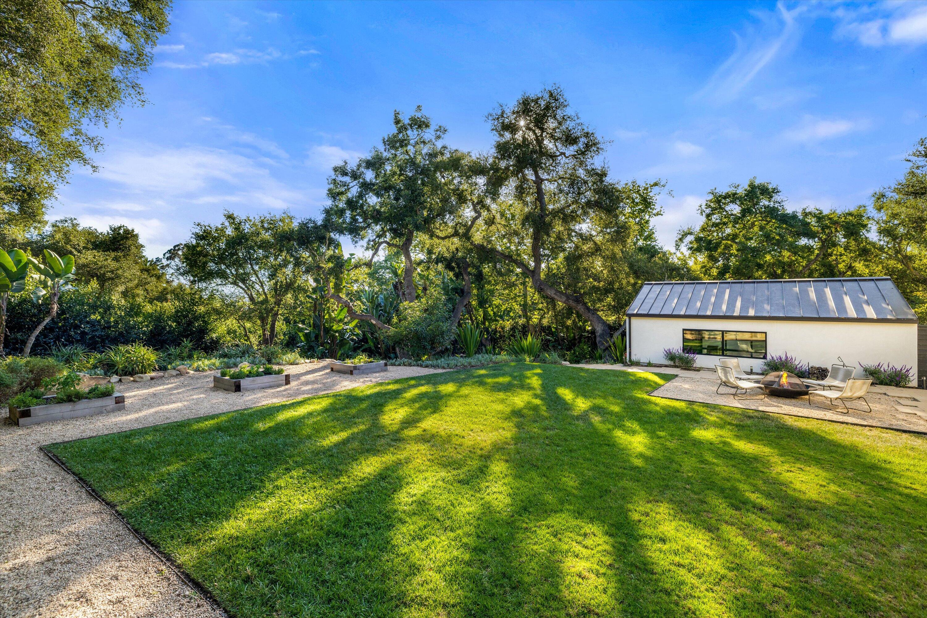840 Riven Rock Road Montecito, CA 93108 - Photo 49 of 52 a swimming pool with outdoor seating and yard