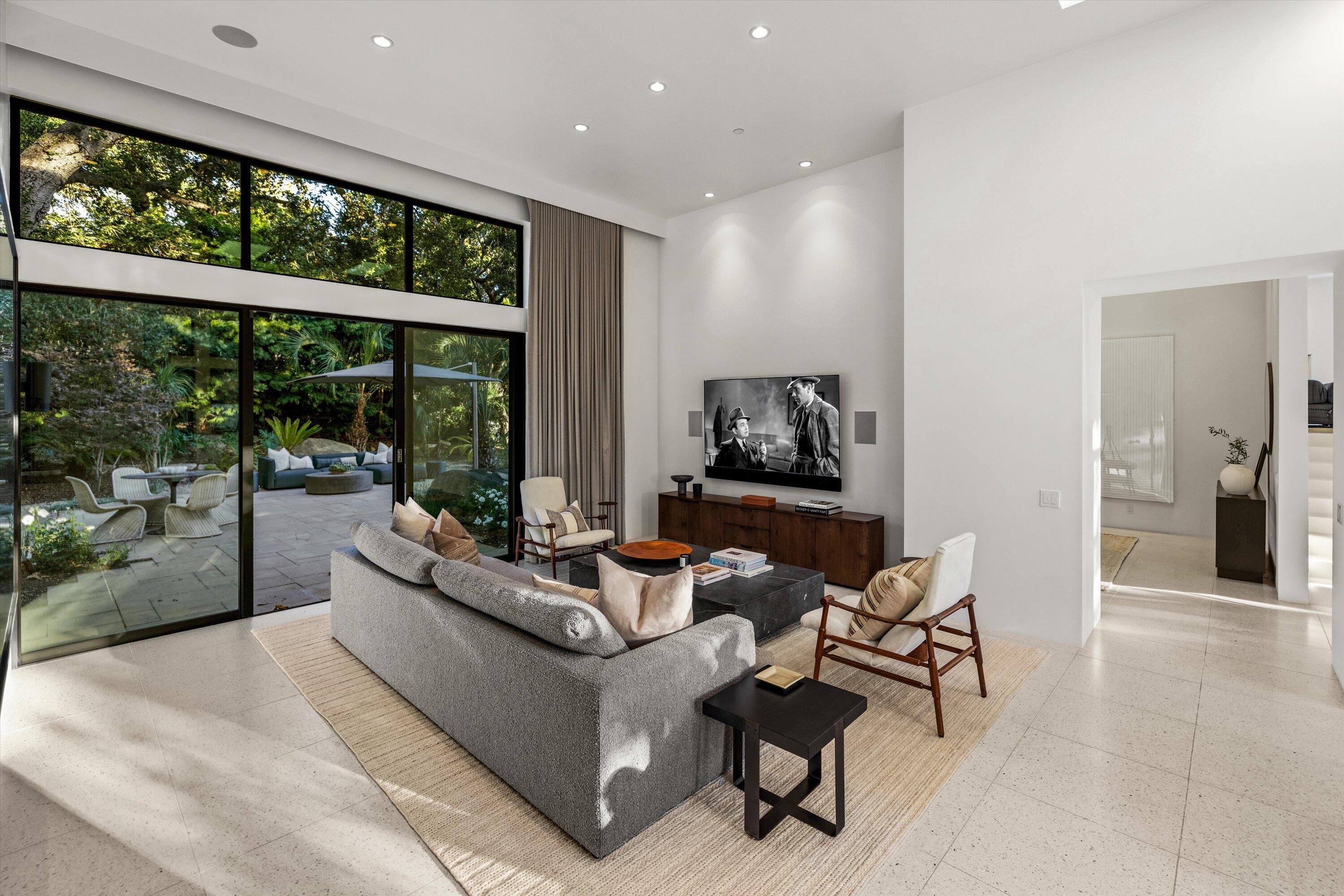 840 Riven Rock Road Montecito, CA 93108 - Photo 7 of 52 a living room with furniture and a floor to ceiling window