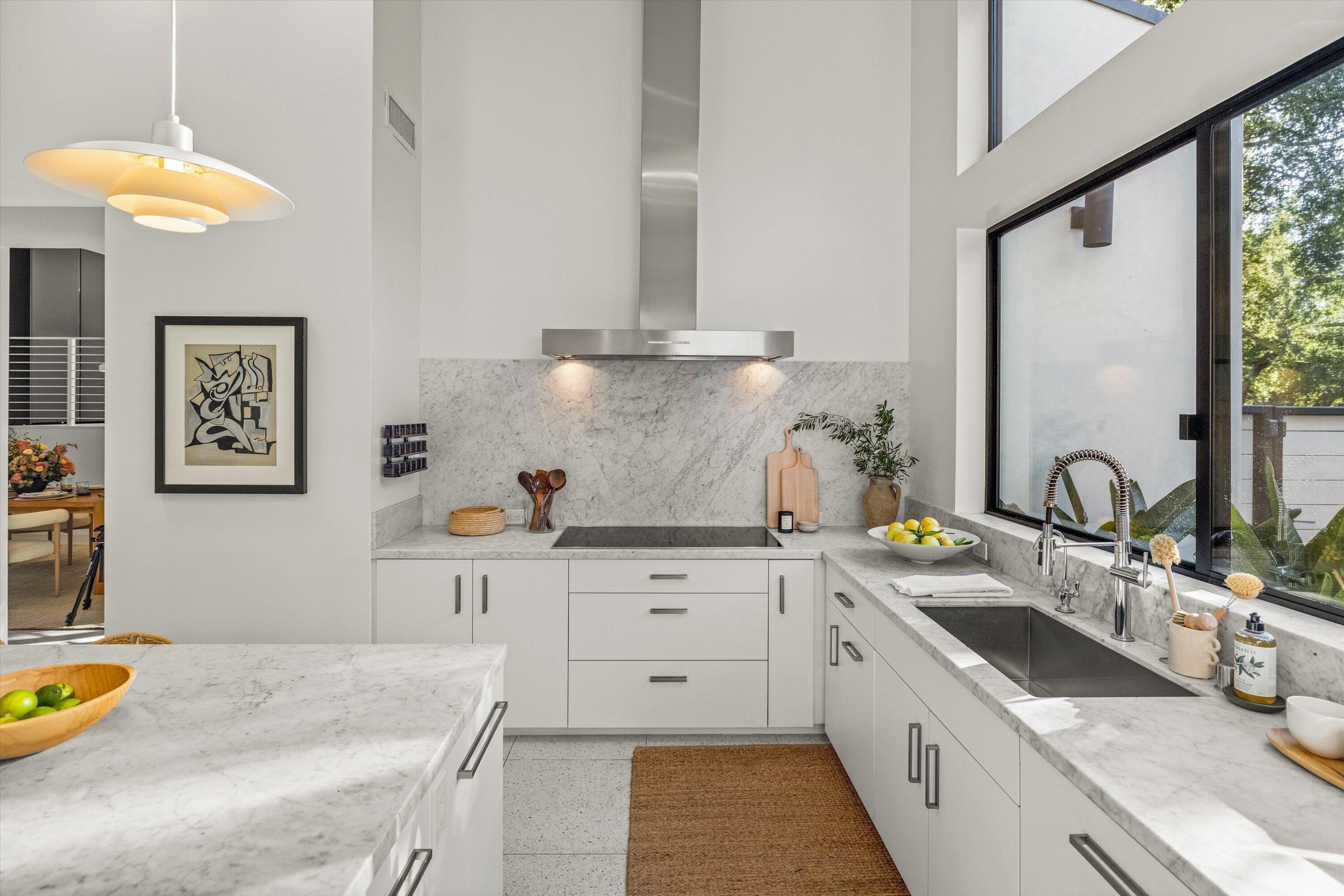 840 Riven Rock Road Montecito, CA 93108 - Photo 10 of 52 a kitchen with a sink stove and cabinets