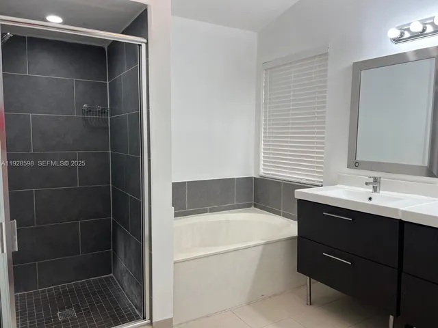 a bathroom with a bathtub and a sink