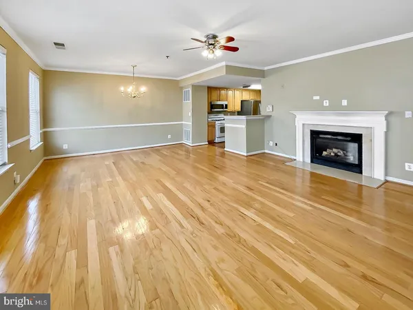 a view of an empty room with a fireplace