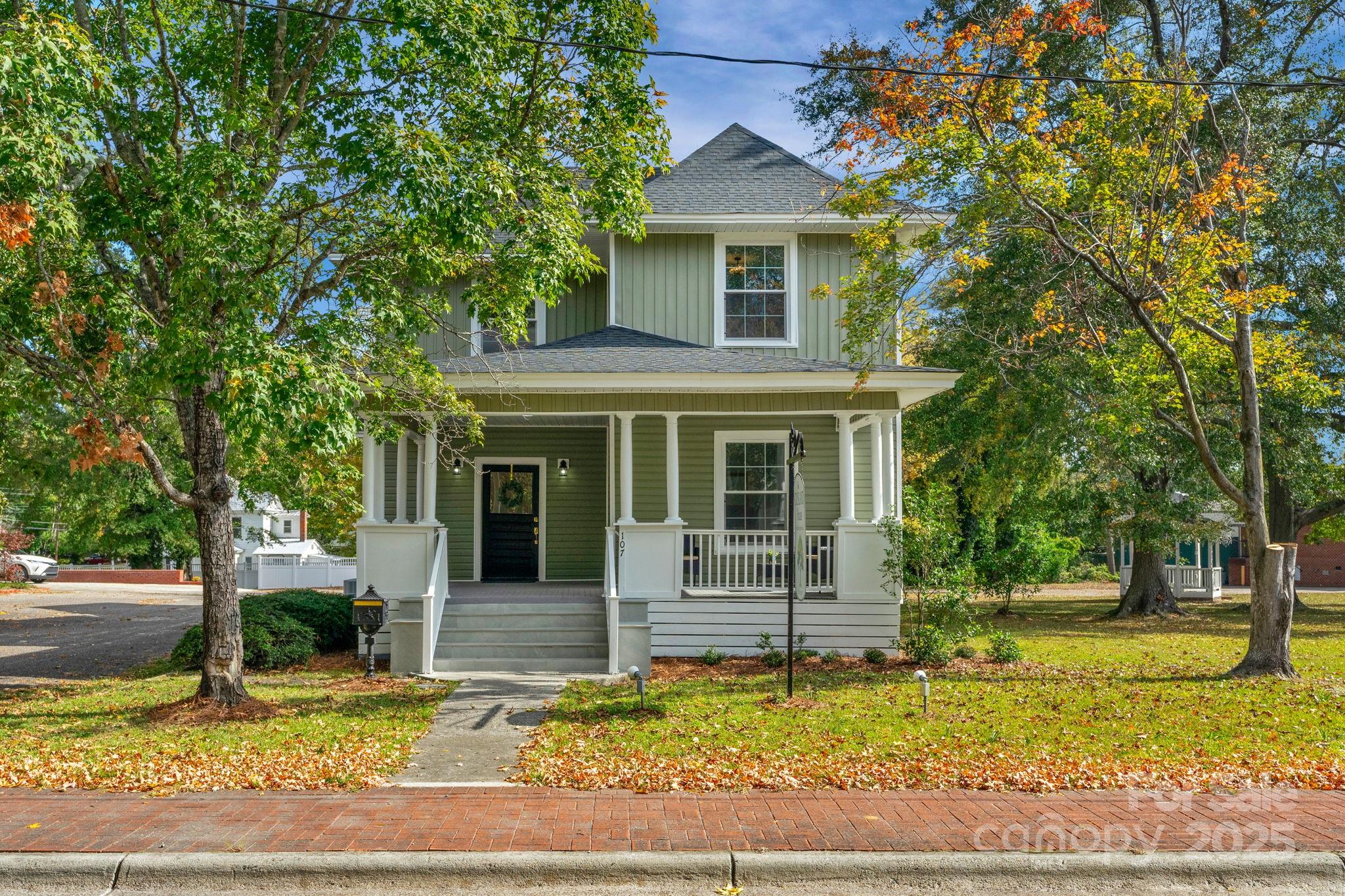 107 Rockingham Road Rockingham, NC 28379 - Photo 2 of 48 a front view of a house with garden