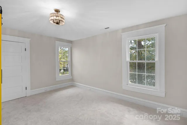 a view of a hallway with bathroom
