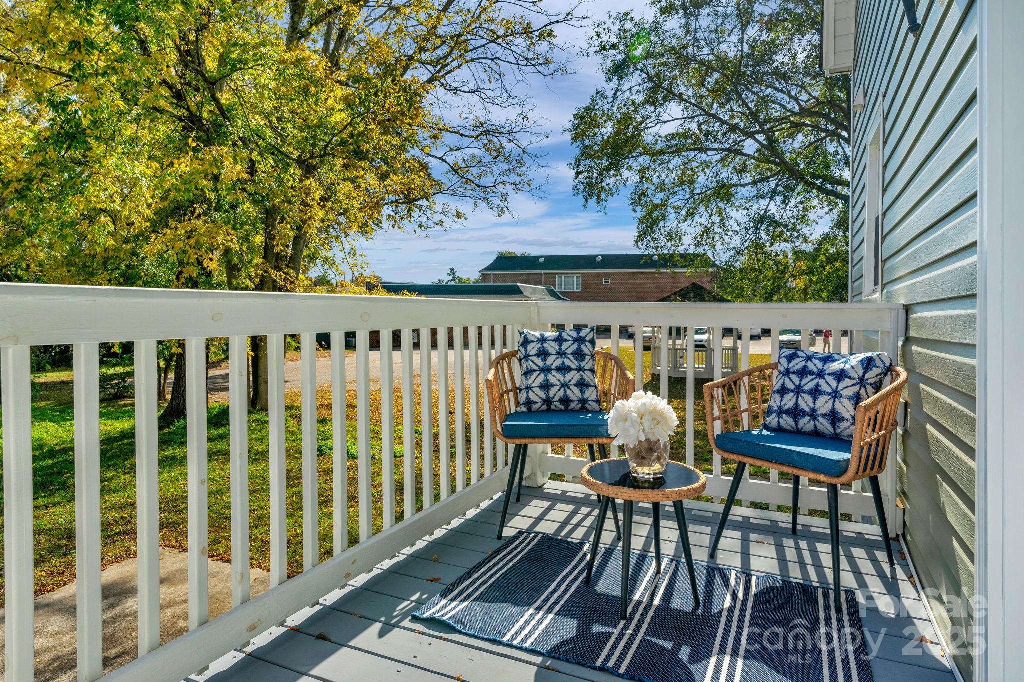 107 Rockingham Road Rockingham, NC 28379 - Photo 41 of 48 a view of a chairs on wooden deck