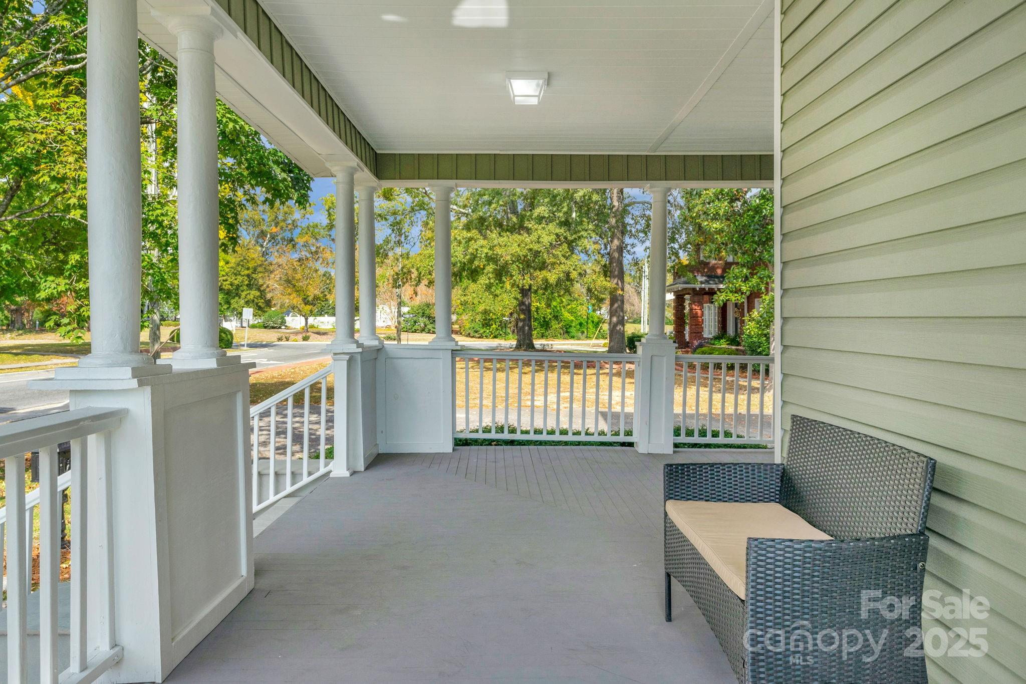 107 Rockingham Road Rockingham, NC 28379 - Photo 6 of 48 a view of a porch with furniture and floor to ceiling window