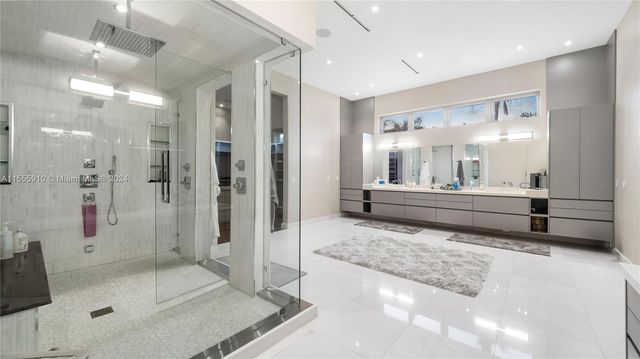 a view of swimming pool with sitting area