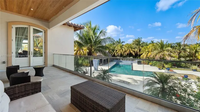 a view of a yard and a palm trees