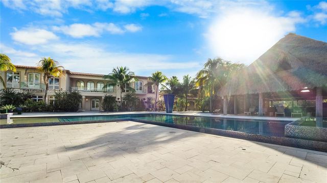 a large kitchen with stainless steel appliances lots of counter space and breakfast area