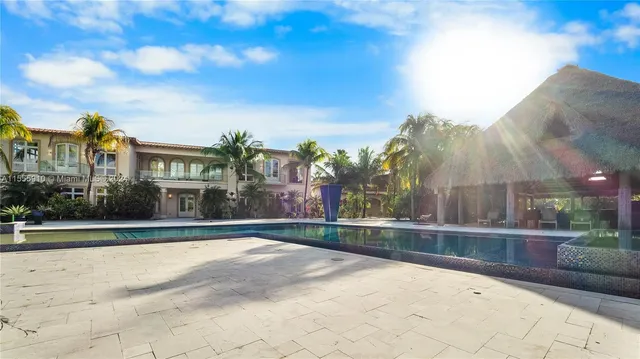 a large kitchen with stainless steel appliances lots of counter space and breakfast area