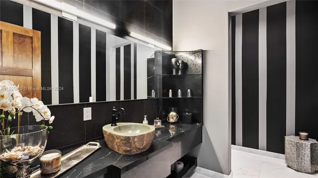 a view of a garden with plants and large trees