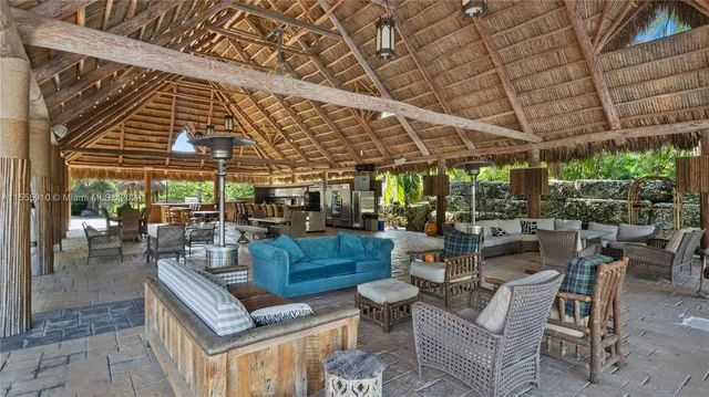 a couple of cars parked in front of a house