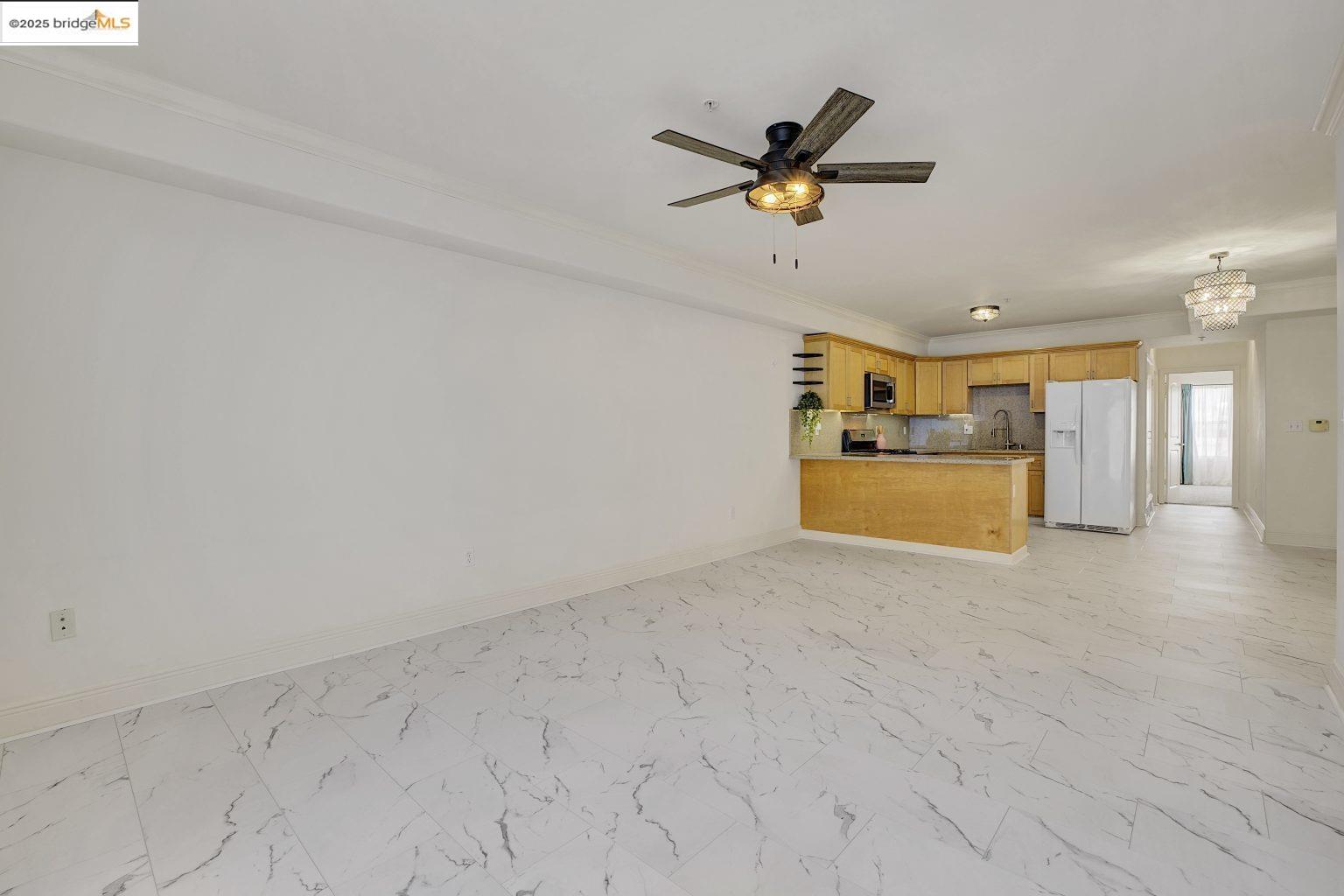 1515 14th Avenue, Unit 302 Oakland, CA 94606 - Photo 13 of 32 a view of empty room with wooden floor and ceiling fan