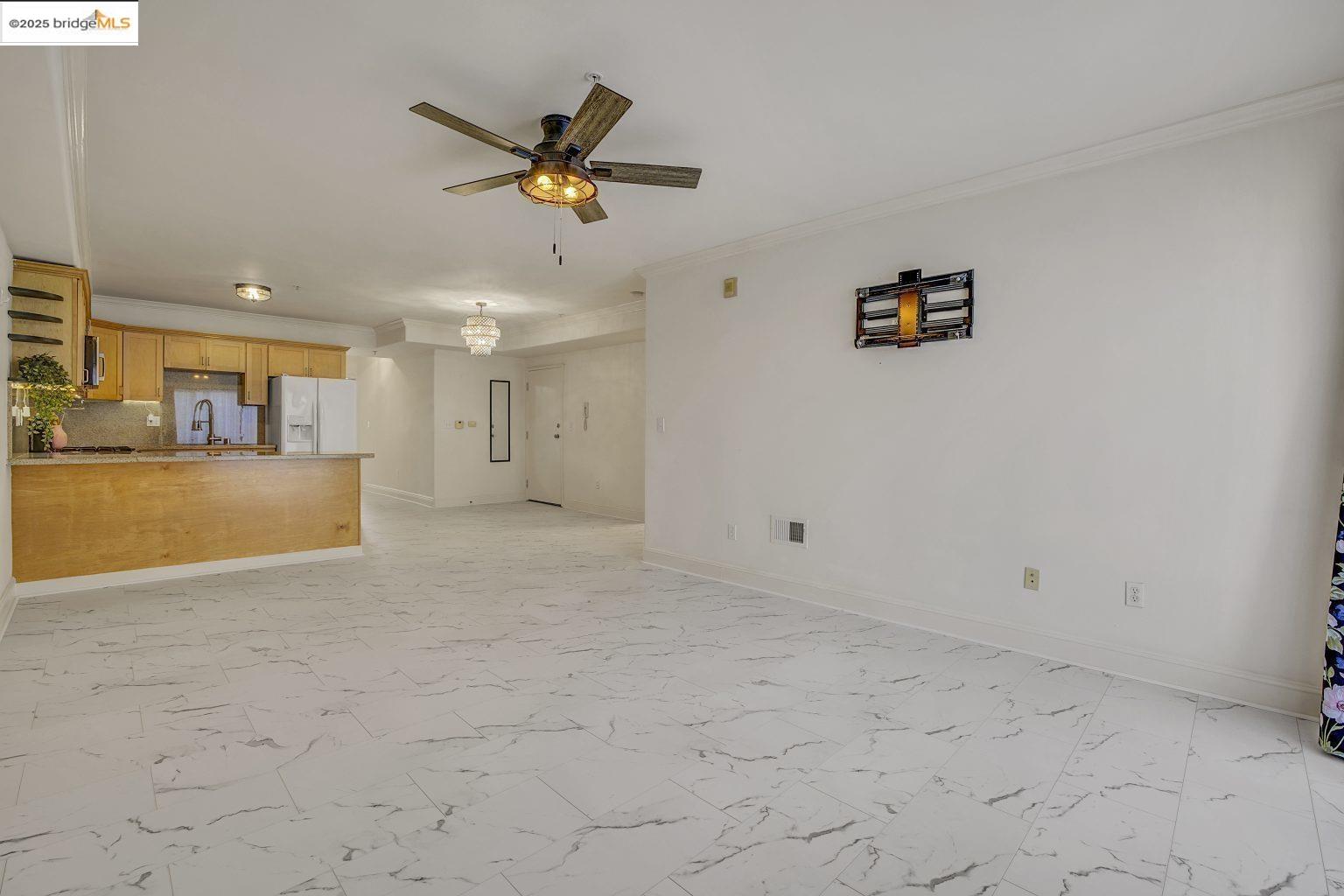 1515 14th Avenue, Unit 302 Oakland, CA 94606 - Photo 14 of 32 a view of a livingroom with a ceiling fan and window