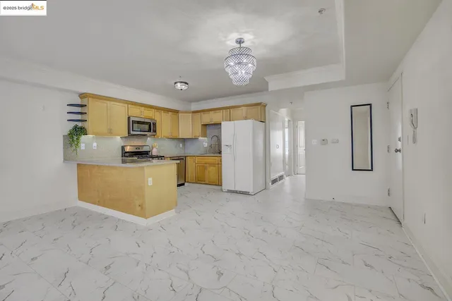 a spacious bathroom with a granite countertop sink a mirror and a