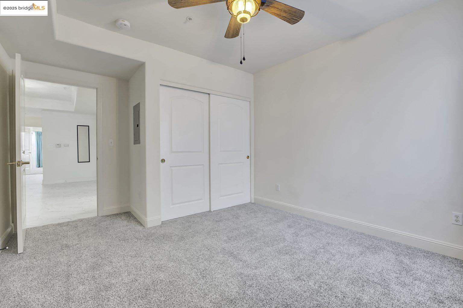 1515 14th Avenue, Unit 302 Oakland, CA 94606 - Photo 22 of 32 a view of an empty room and chandelier fan