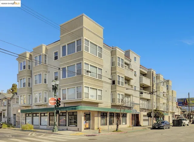 a picture of a room with a white wall and a refrigerator