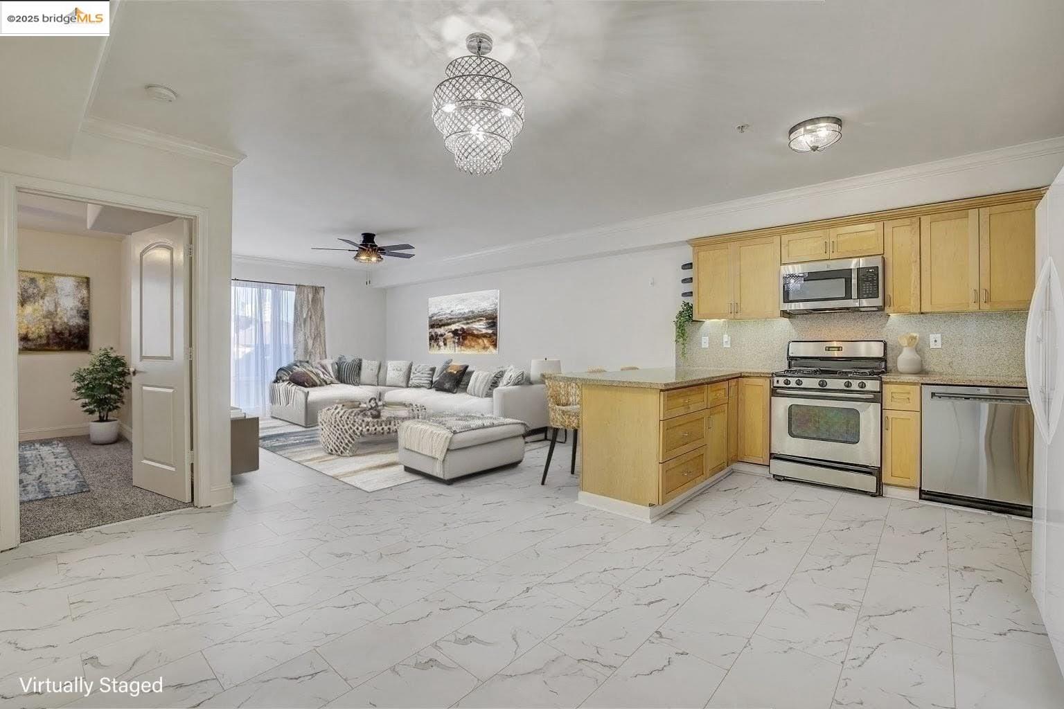 1515 14th Avenue, Unit 302 Oakland, CA 94606 - Photo 3 of 32 a living room with furniture and kitchen view