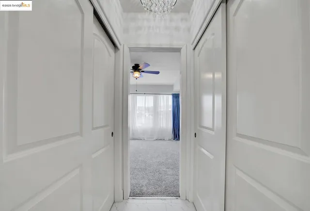 a bathroom with a granite countertop sink a mirror and a bathtub