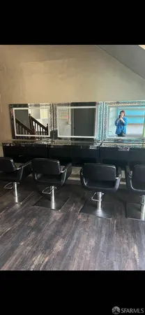 a living room with furniture and a piano