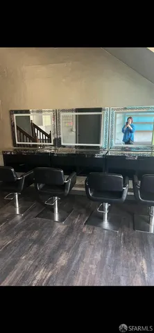 a living room with furniture and a piano