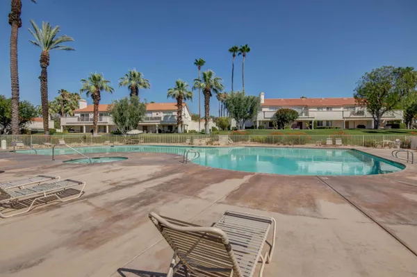 a room with gym equipment and windows
