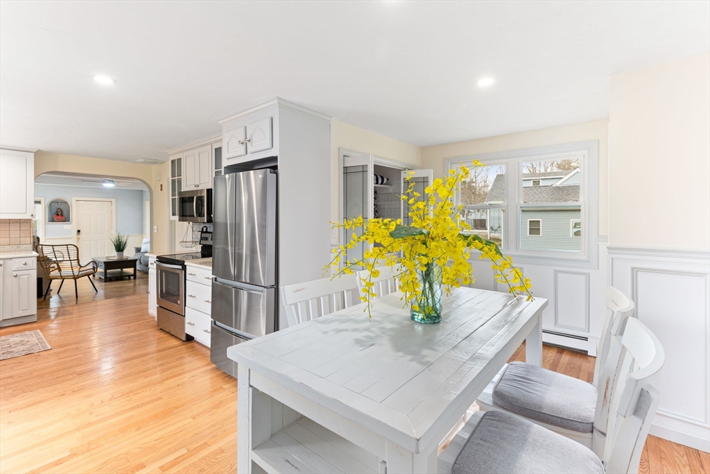 17 Weaver Street Wareham, MA 02576 - Photo 14 of 37 a kitchen with stainless steel appliances refrigerator dining table and chairs