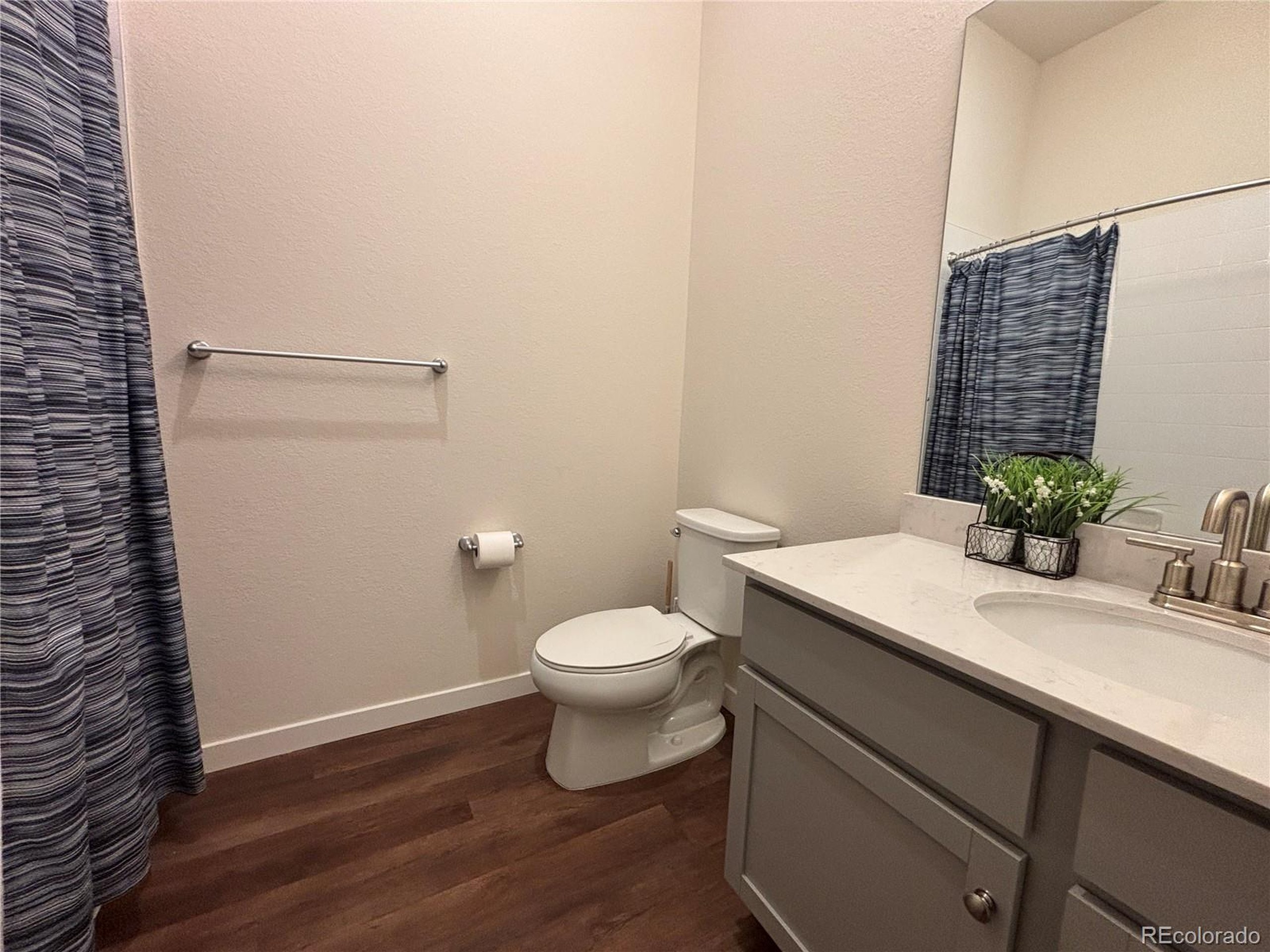 437 Interlocken Boulevard, Unit 102 Broomfield, CO 80021 - Photo 15 of 27 a bathroom with a sink and a toilet