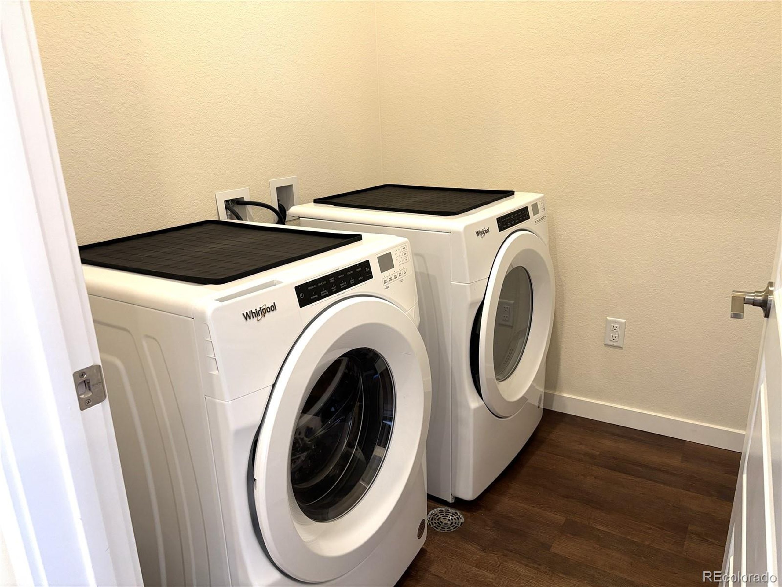 437 Interlocken Boulevard, Unit 102 Broomfield, CO 80021 - Photo 17 of 27 a utility room with dryer and washer