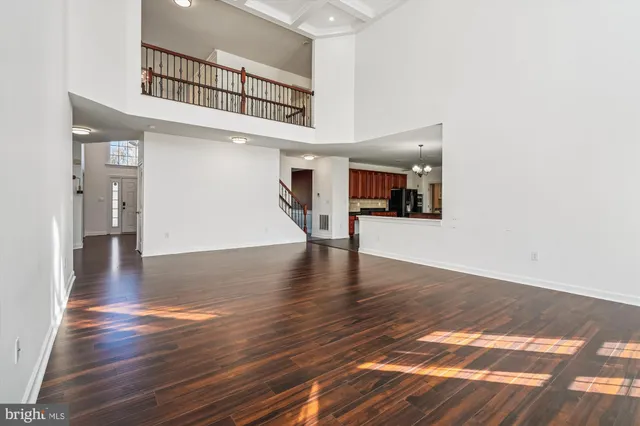 a large kitchen with granite countertop a stove and a sink