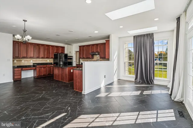 a view of an entryway with wooden floor and door