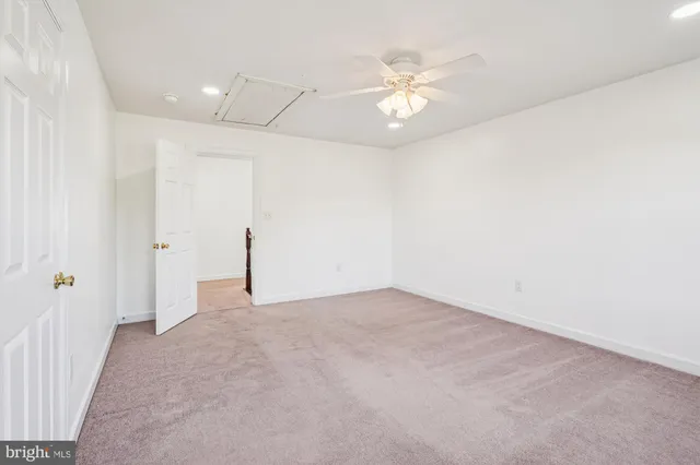 a view of yard with swimming pool and green space